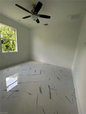 Unfurnished room with ceiling fan