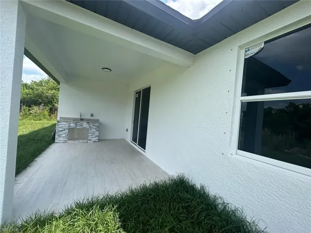 View of side of property featuring a patio
