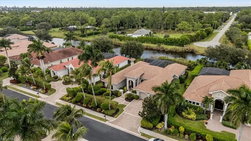 Aerial view of residential area featuring a large body of water