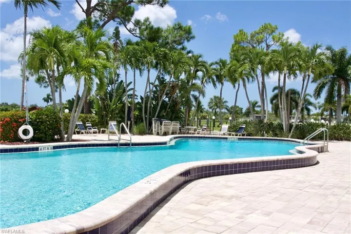 Main Community pool featuring a patio area ajacent to the course and the 19th hole