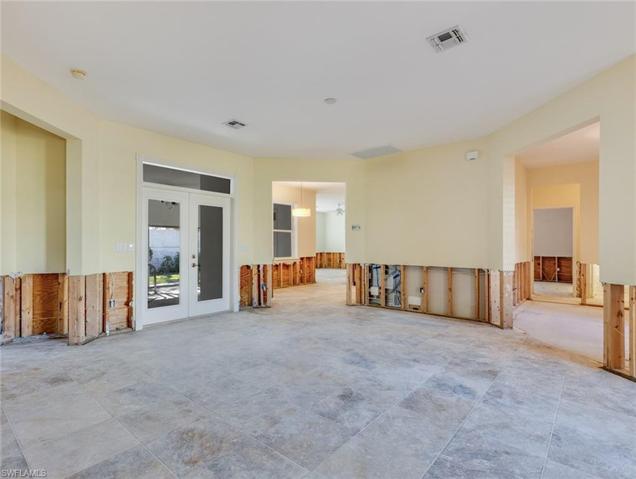 Liven room view to patio, breakfast area, and family room