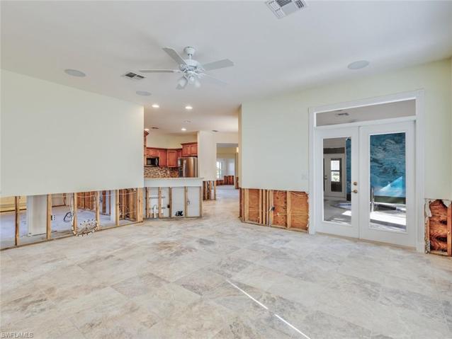 Family to kitchen and enclosed patio with spa
