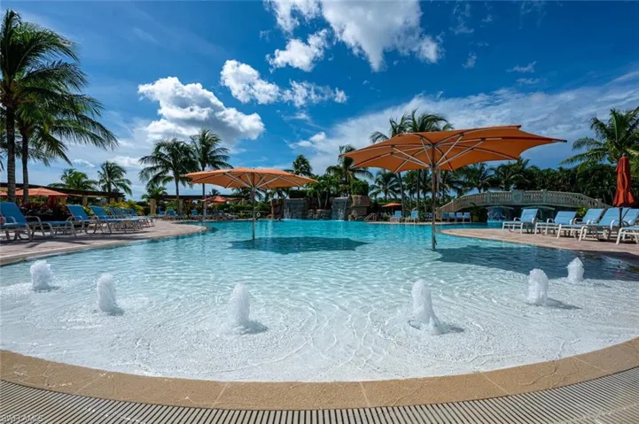 Treviso Bay's main pool is a luxurious oasis blending resort-style relaxation with Naples' vibrant ambiance