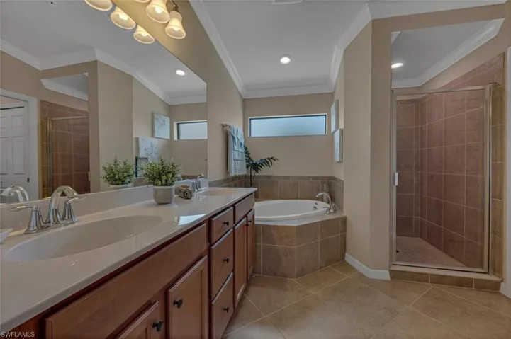 Unwind in style in the spa-like primary bath complete with soaking tub and separate shower