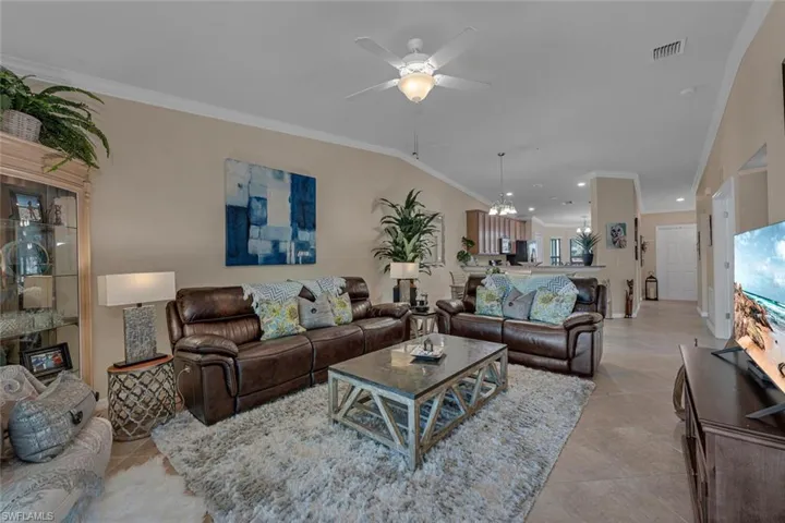 The vaulted ceiling and open concept design provide an inviting airy space that embraces Florida's sunshine and coastal vibes