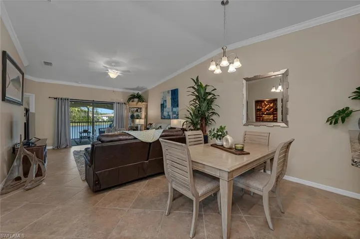 Chic dining space infused with Florida's charm is ideal for entertaining.