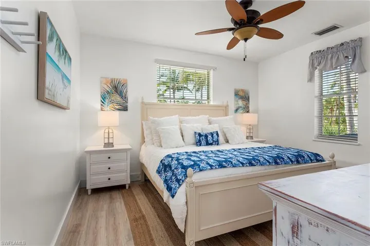 Bedroom with wood finished floors and ceiling fan