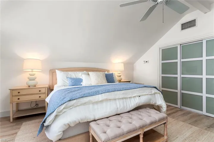 Bedroom with light wood finished floors and ceiling fan