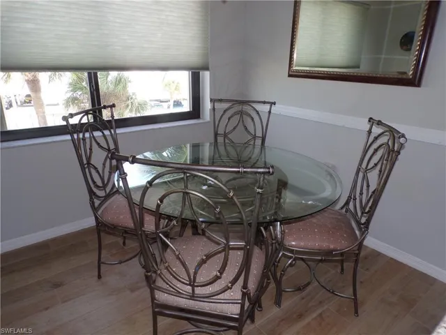 Dining room featuring wood finished floors and baseboards