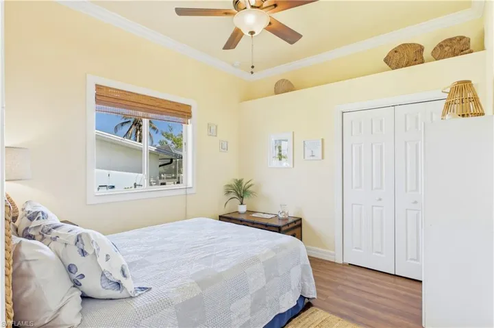 3rd Guest Bedroom - Charming guest bedroom offers vaulted ceilings, warm wood-look flooring & a light coastal feel perfect for family or visiting guests.