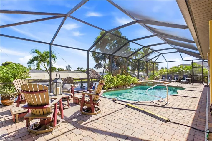 OVERSIZED SCREENED LANAI showcases HEATED POOL & SPA