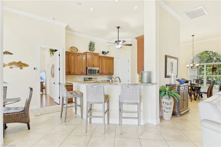 Inviting bar area offers the perfect space for casual dining, morning coffee or gathering with guests while entertaining.