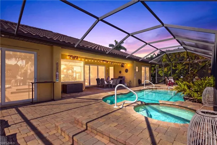 Resort-style heated spa creates the perfect setting to unwind beneath breathtaking SWFL sunsets and tropical evening skies.