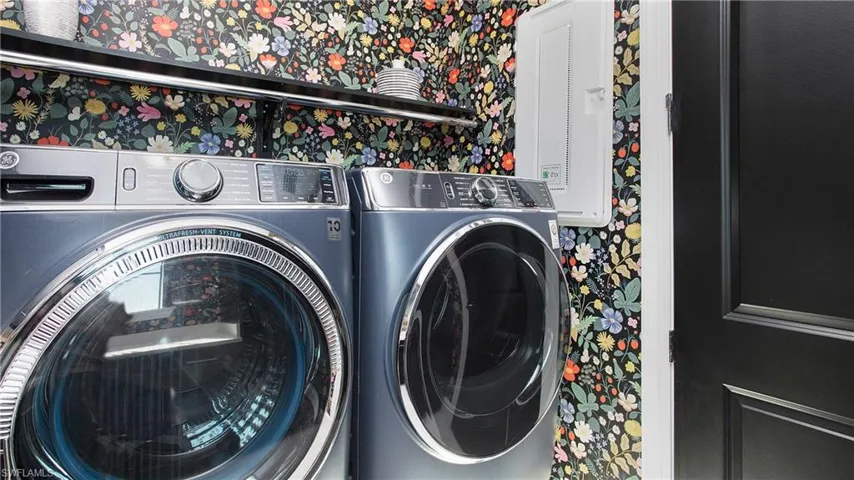 Washroom featuring washer and dryer