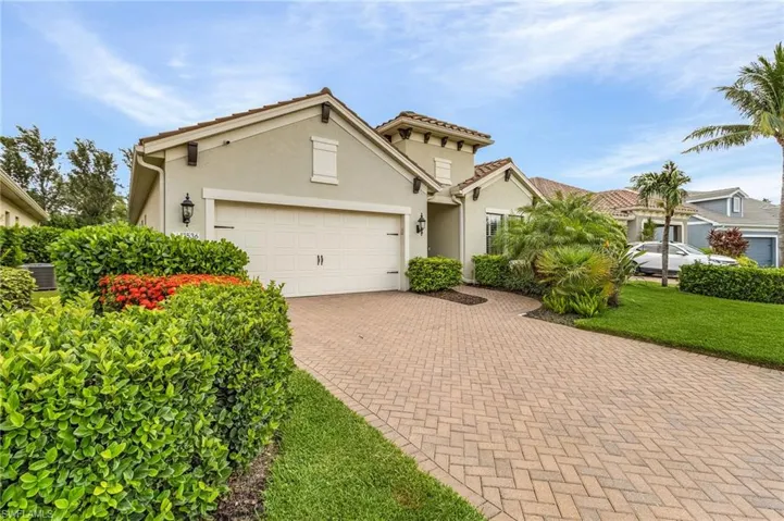 Mediterranean / spanish-style house with a garage