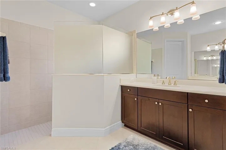 Bathroom featuring tile floors and vanity
