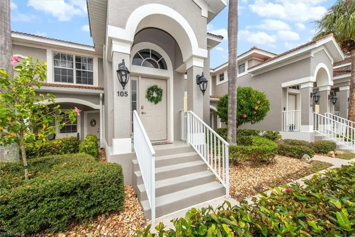 Entrance to property with stucco siding