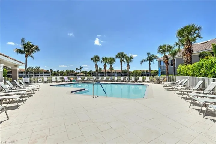 Community pool with a patio area