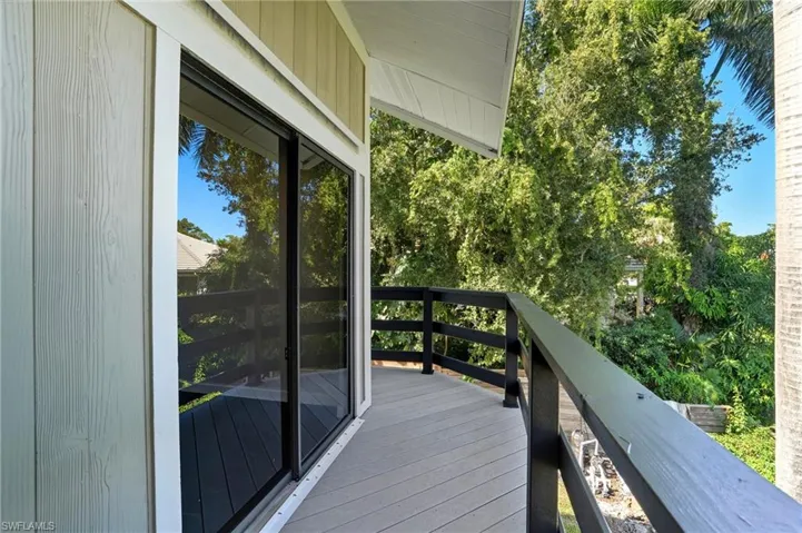 Outdoor balcony featuring composite decking and black railings