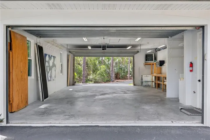 4 car garage with tall garage doors in front and back!