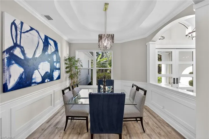 Spacious dining room with detailed walls and ceiling!