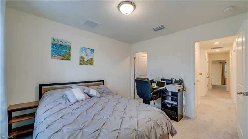 Bedroom with light carpet