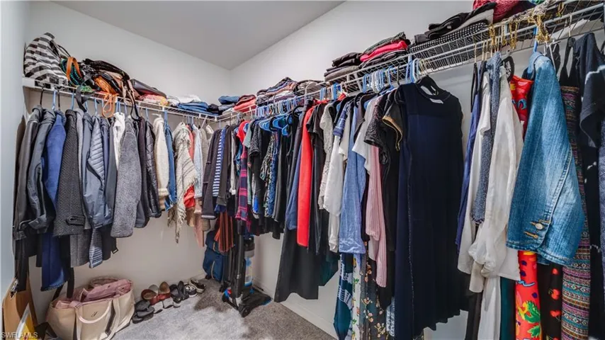 Walk in closet in primary bedroom