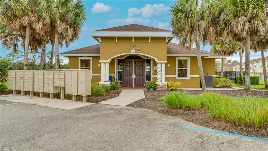 View of front of home with a shingled roof and stucco siding