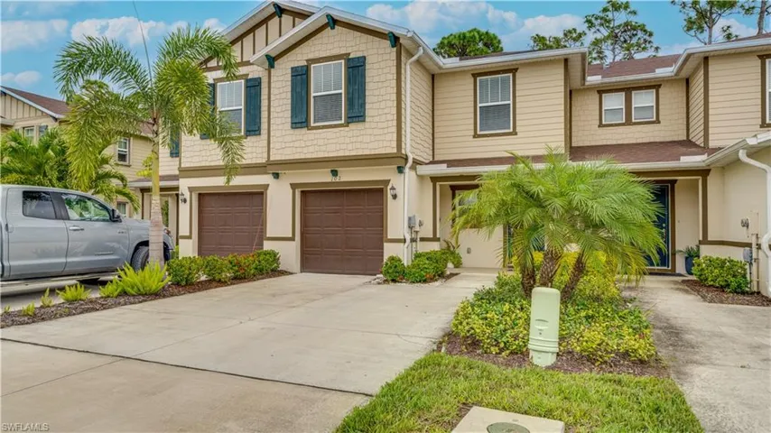 Craftsman-style house with driveway and a garage