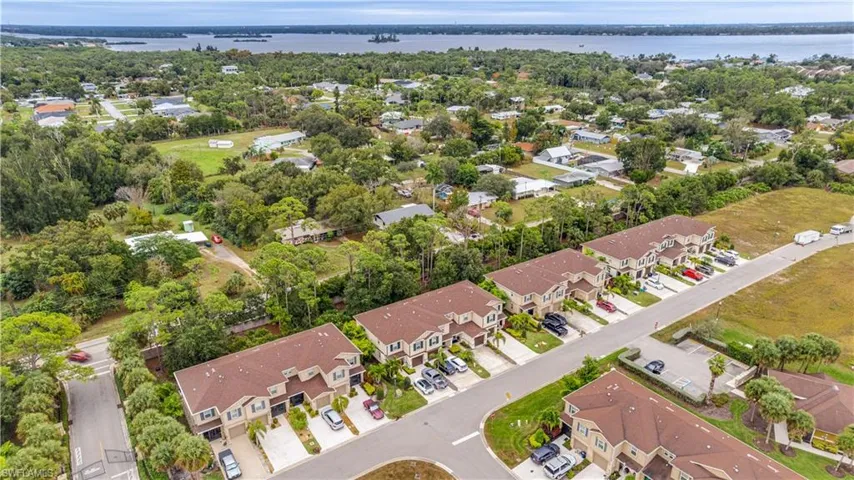 Aerial view of residential area featuring a large body of water