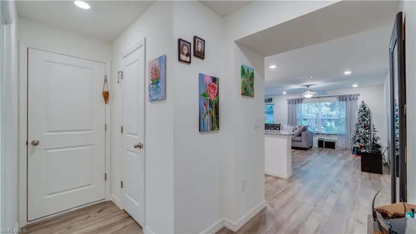 Hall featuring recessed lighting and light wood finished floors