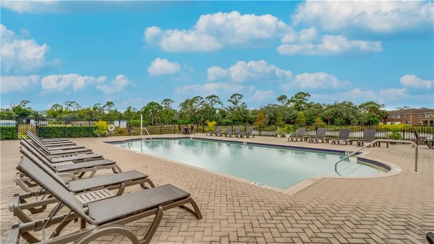 Community pool with a patio area