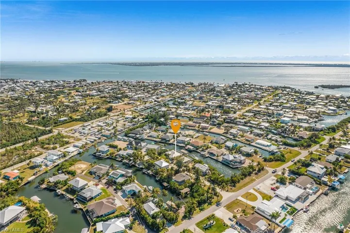 Looking SW toward San Carlos Bay and the ICW with the Gulf on the left in the background.  Sanibel is in the middle and right in the background.
