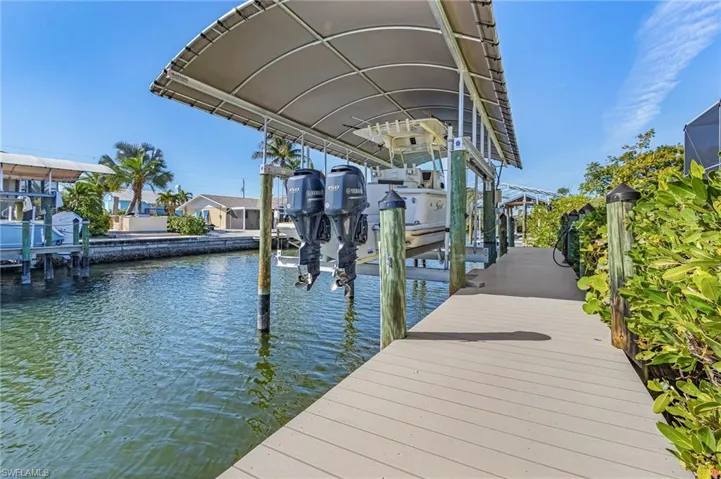 Covered 13K# boat lift with 70' of composite dock.