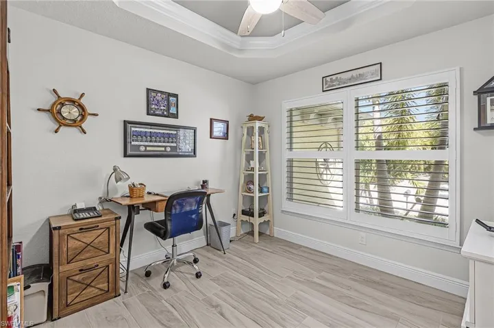 Office/Den just past the entry with Plantation Shutters.