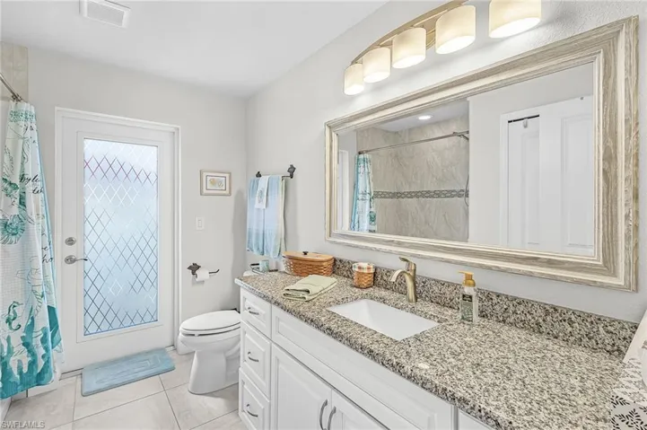 Guest Bath with door leading to the pool.