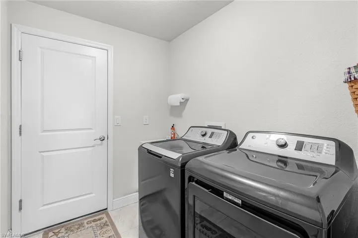 Laundry with entry to the garage.