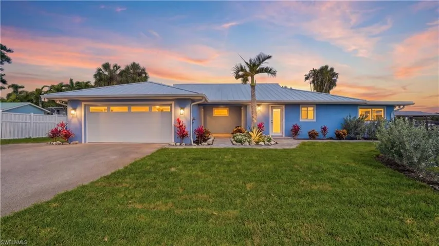 Front of home with evening lighting