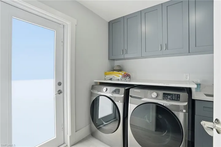 laundry room with exterior door