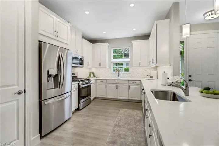 Excellent amount of storage and light in this villa kitchen with quartz countertops