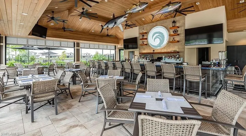 Dining area with wood ceiling, high vaulted ceiling, and a ceiling fan