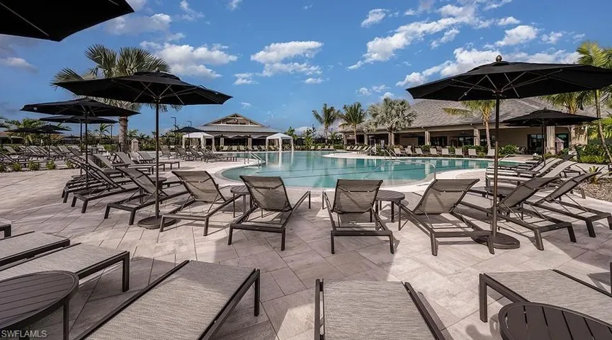 Community pool with a patio area
