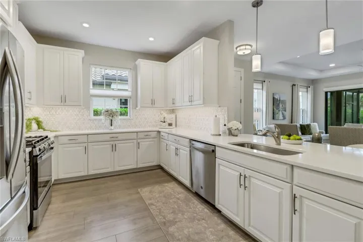 Kitchen open to living and dining room spaces