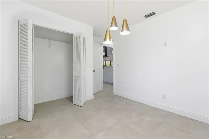 Unfurnished bedroom with baseboards and a closet