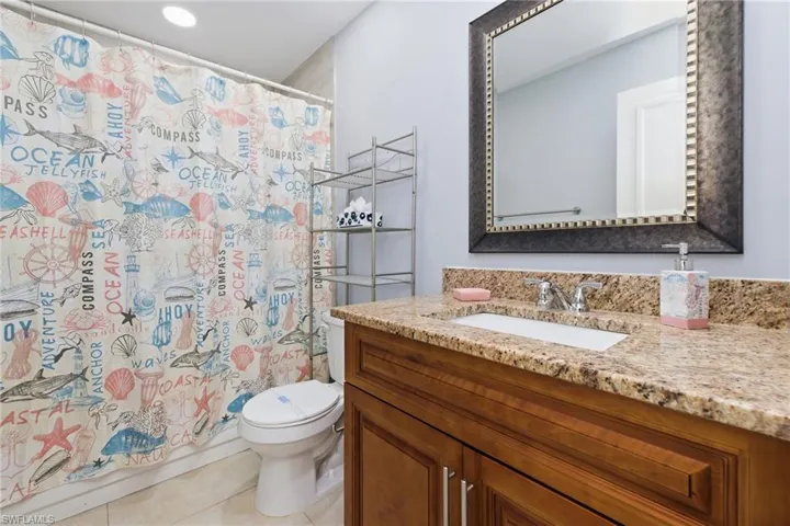 Bathroom with vanity and light tile patterned floors