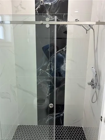 Full bath featuring a stall shower