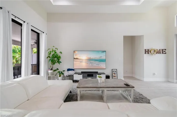 Living room featuring a high ceiling