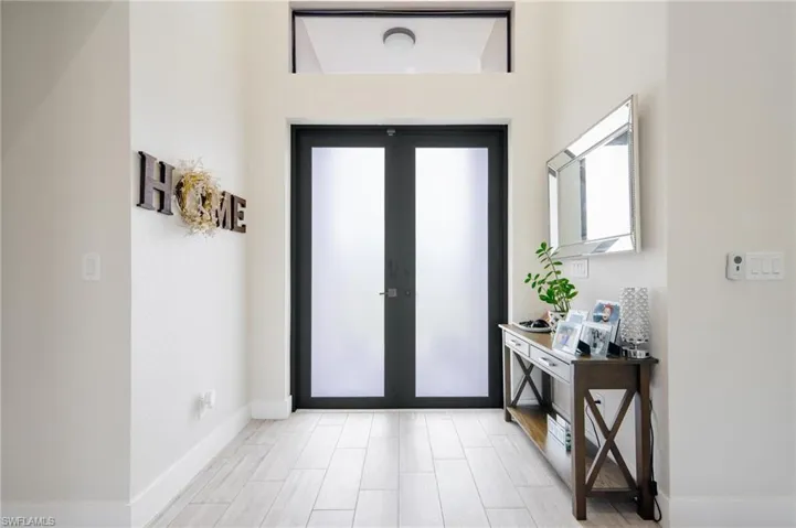 Entrance foyer featuring french doors
