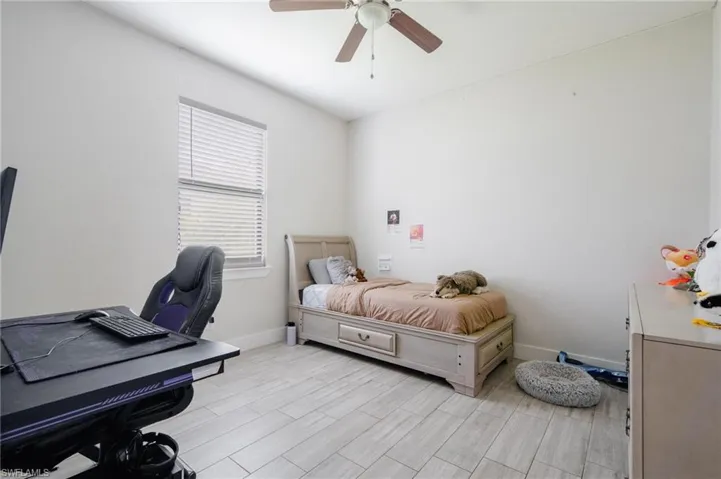 Bedroom featuring light hardwood / wood-style flooring and ceiling fan