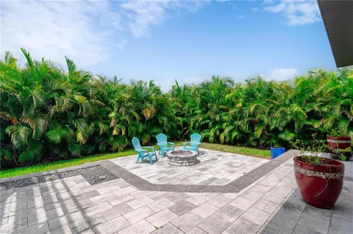 View of patio featuring an outdoor fire pit